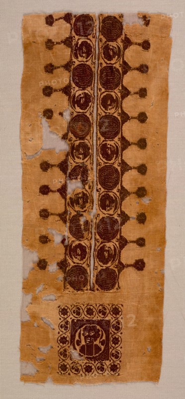 Neck and Shoulder Decoration from a Tunic, late 400s - 500s. Egypt, Byzantine period, late 5th - 6th century. Plain weave with slit-tapestry weave and supplementary weft wrapping; dyed wool, undyed linen; overall: 14.3 x 35.6 cm (5 5/8 x 14 in.)