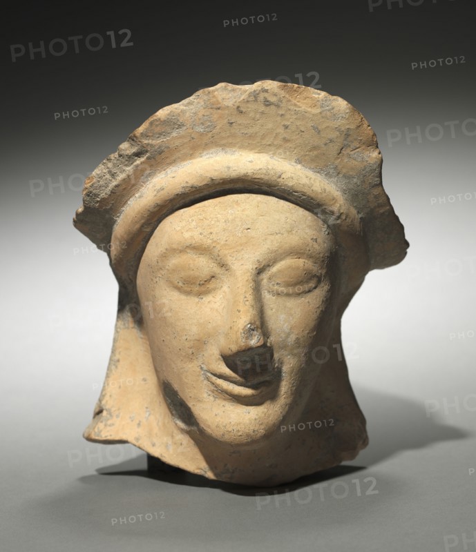 Woman's Head with Crown, 500s BC. Greece, Sicily (?), 6th Century BC. Terracotta; overall: 15.8 cm (6 1/4 in.).