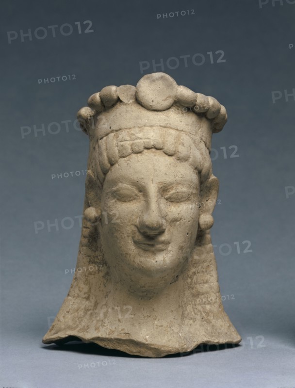 Woman's Head with Crown and Earrings, 600-475 BC. Greece, Sicily (?), 6th Century BC, or early 5th Century. Terracotta; overall: 15.2 cm (6 in.).