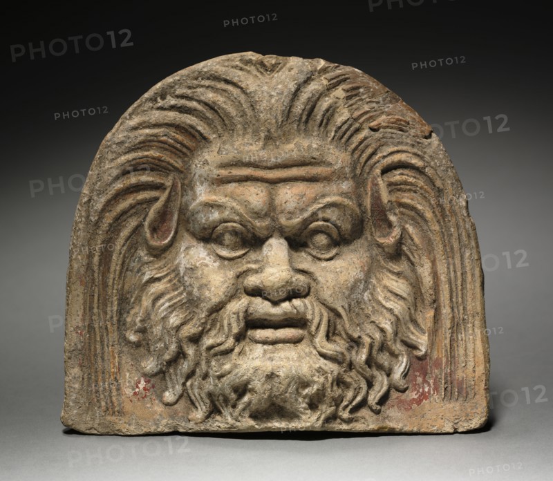 Antefix with Satyr Face, 370-330 BC. Italy, mid-4th Century BC. Terracotta; overall: 17.1 cm (6 3/4 in.).