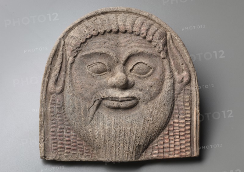 Antefix with Satyr Face, 450-400 BC. Italy, Tarentum, 2nd half 5th Century BC. Terracotta; overall: 25 cm (9 13/16 in.).