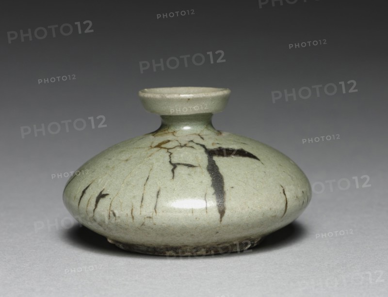 Oil Bottle, 1100s-1200s. Korea, Goryeo period (918-1392). Celadon ware; outer diameter: 7.4 cm (2 15/16 in.); overall: 4.6 cm (1 13/16 in.).