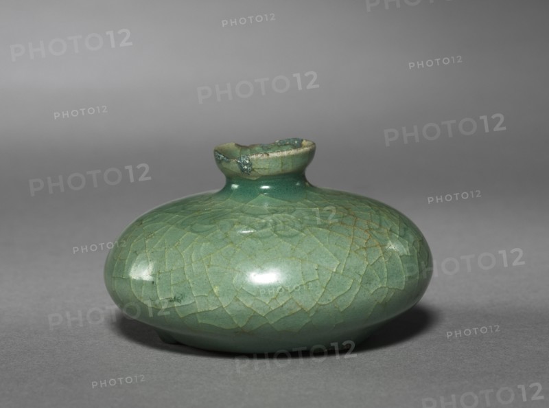 Oil Bottle with Scroll Design, 1100s-1200s. Korea, Goryeo period (918-1392). Celadon ware; outer diameter: 7.4 cm (2 15/16 in.); overall: 4.2 cm (1 5/8 in.).