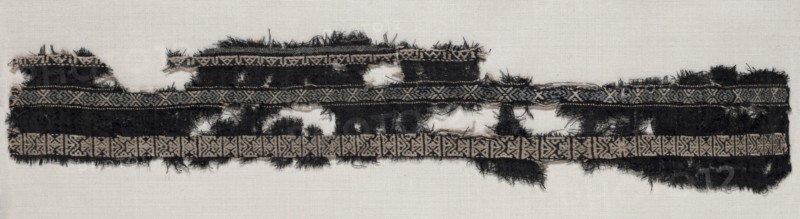 Fragment of Border, 800s. Egypt, 9th century. Wool: plain weave wtih supplementary weft; overall: 9 x 46.4 cm (3 9/16 x 18 1/4 in.)