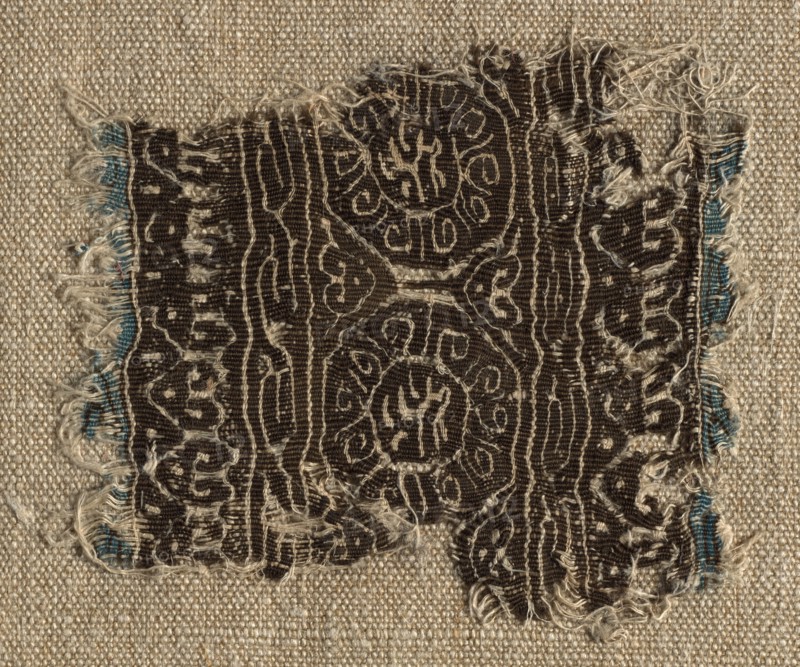 Fragment of a Tiraz-Style Textile, 1130 - 1149. Egypt, Fatimid period, Caliphate of al-Hafiz, AH 524-544, 12th Century. Tapestry (originally inwoven in a tabby ground); linen and silk; overall: 7.4 x 6.4 cm (2 15/16 x 2 1/2 in.).