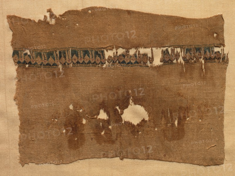 Fragment of a Tiraz-Style Textile, 1081 - 1094. Egypt, Fatimid period, Caliphate of of al-Mustansir, AH 475-487, 11th Century. Tabby ground with inwoven tapestry ornament; linen and silk; overall: 12.1 x 16.3 cm (4 3/4 x 6 7/16 in.)