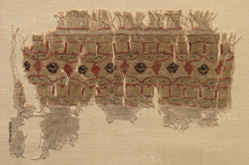 Fragment of a Tiraz-Style Textile, 1101 - 1149. Egypt, Fatimid period, Caliphate of al-Amir or al-Hafiz, AH 495-544, 12th Century. Tabby ground with inwoven tapestry ornament; linen and silk; overall: 8.3 x 12.7 cm (3 1/4 x 5 in.).