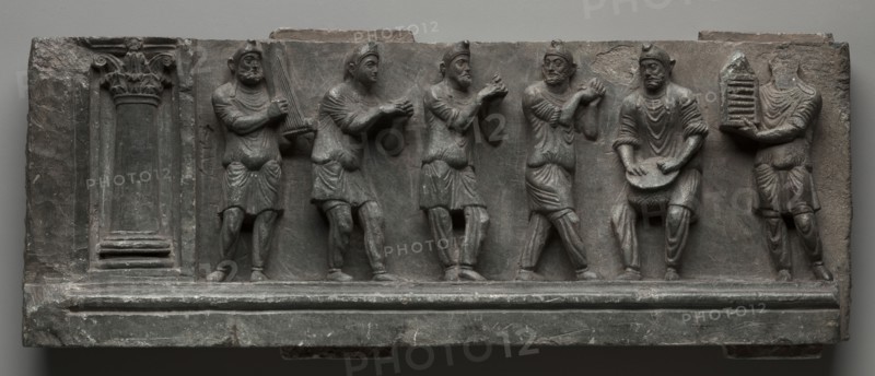 Bacchanalian Relief, 1-100. Pakistan, Gandhara, Buner area, early Kushan Period (AD 1-320). Schist; overall: 17.1 x 44.5 cm (6 3/4 x 17 1/2 in.).