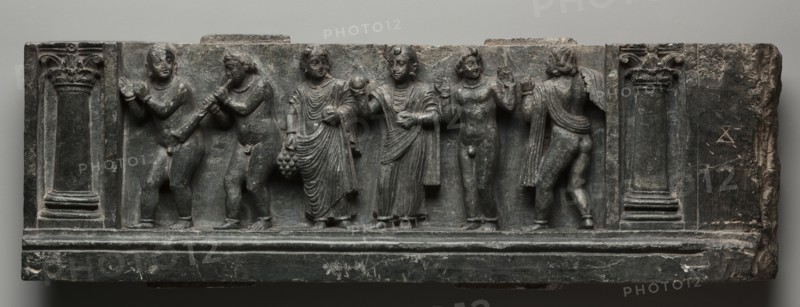 Bacchanalian Relief, 1-100. Pakistan, Gandhara, Buner area, early Kushan Period (AD 1-320). Schist; overall: 16 x 53 cm (6 5/16 x 20 7/8 in.).