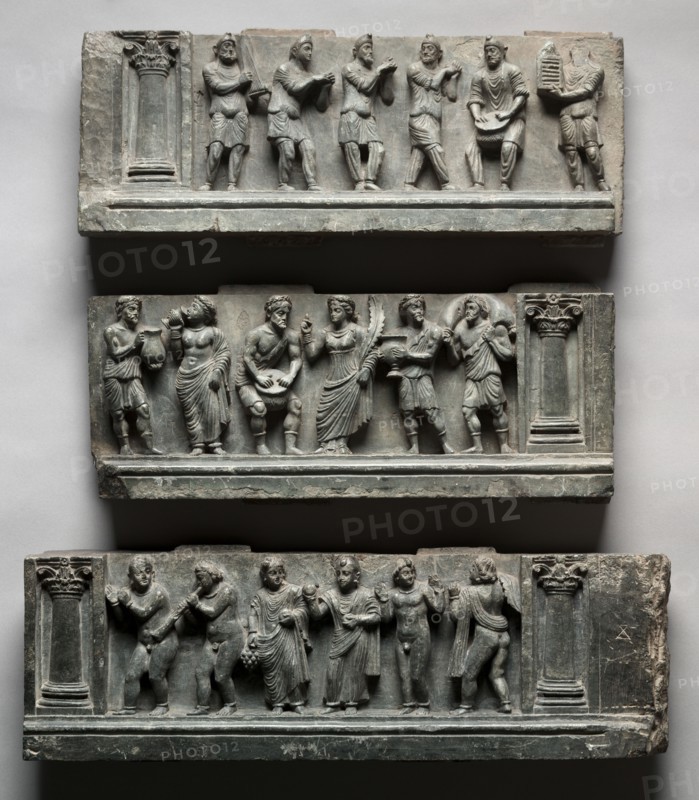Bacchanalian Relief, 1-100. Pakistan, Gandhara, Buner area, early Kushan Period (AD 1-320). Schist; overall: 49.6 x 150.5 cm (19 1/2 x 59 1/4 in.); first section: 17.1 x 44.5 cm (6 3/4 x 17 1/2 in.); second section: 16.5 x 53 cm (6 1/2 x 20 7/8 in.); third section: 16 x 53 cm (6 5/16 x 20 7/8 in.).