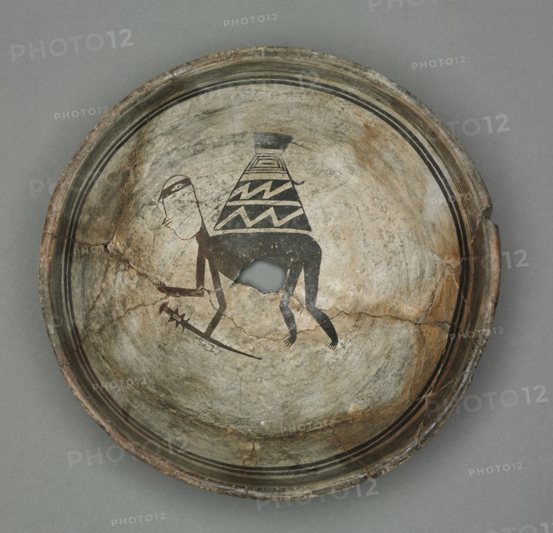 Bowl with Burden-Bearing Human, c. 1000-1150. Southwest, Mogollon, Mimbres, Pre-Contact Period, 11th-12th century. Earthenware; diameter: 25.4 cm (10 in.); overall: 10.5 x 25.5 cm (4 1/8 x 10 1/16 in.).