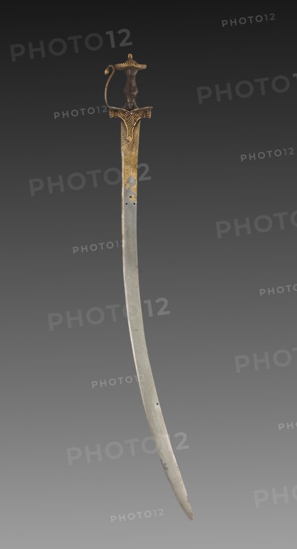 Tulwar Sword, 1700s. India, probably Deccan, 18th century. Iron hilt with gold; steel blade with gold; overall: 96.6 cm (38 1/16 in.).