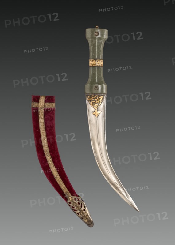 Khanjar dagger, c. 1600s. India, 17th century. Jade hilt with iron and gold; steel blade with iron and gold; wood sheath covered in velvet with metallic thread; overall: 34.4 cm (13 9/16 in.).