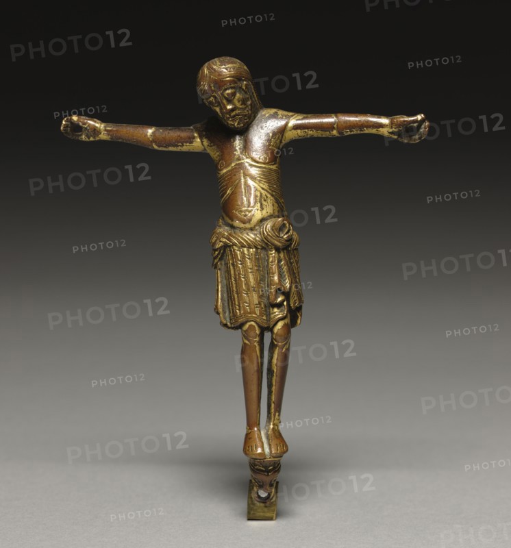 Crucified Christ, c. 1200. Germany, Rhine Valley, Romanesque  period,  early 13th century. Gilt bronze; overall: 14.6 x 12.4 cm (5 3/4 x 4 7/8 in.)