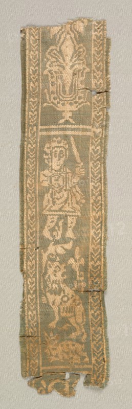 Silk Decorative Tunic Band with a Hunter, 700s. Egypt or Syria, Islamic period, late Umayyad or Abbasid, 8th century. Complementary weft-faced twill with inner warps (samit); silk; overall: 27 x 6.4 cm (10 5/8 x 2 1/2 in.)