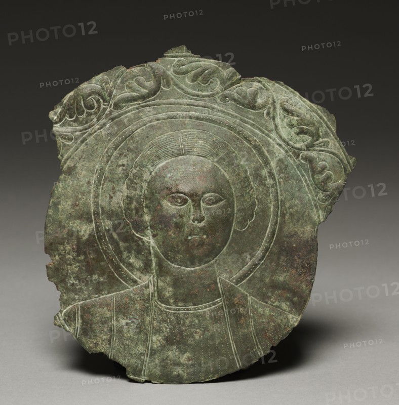 Door Plaque with the Head of a Saint, 500s. Byzantium, Syria(?), Byzantine period, 6th century. Bronze; overall: 18.5 x 17.2 x 1.6 cm (7 5/16 x 6 3/4 x 5/8 in.).