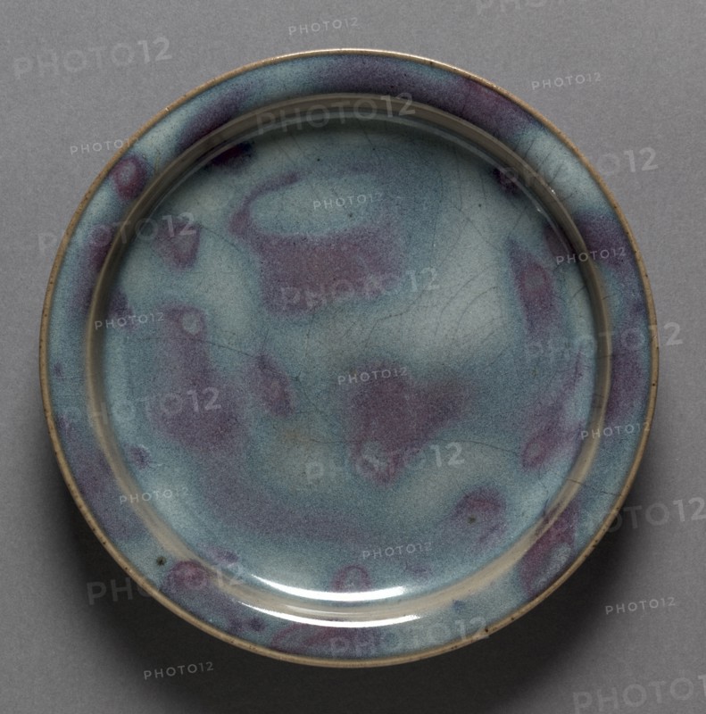 Plate:  Jun Ware, 1100s-1200s. Northern China, Northern Song dynasty (960-1127) - Jin dynasty (1115-1234). Stoneware with mottled glaze; diameter: 18.1 cm (7 1/8 in.); overall: 2.5 cm (1 in.).