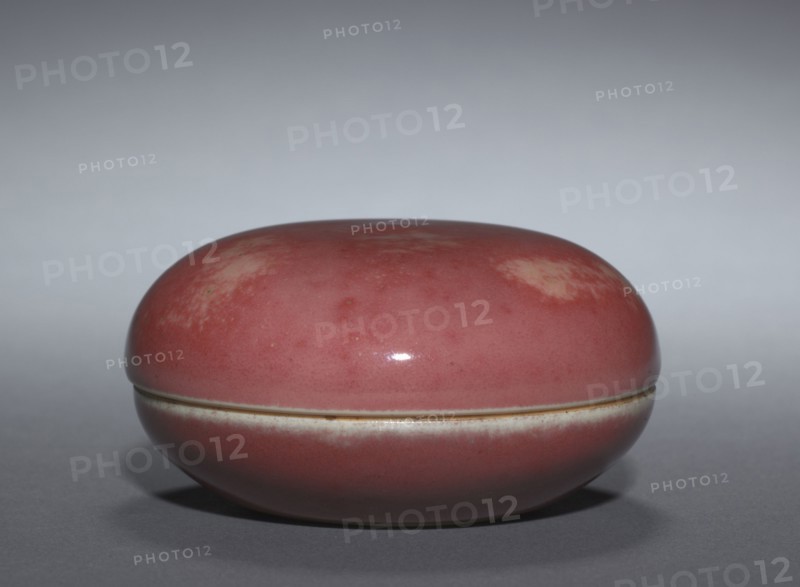 Seal Color Box , 1662-1722. China, Jiangxi province, Jingdezhen, Qing dynasty (1644-1912), Kangxi Period (1662-1722). Porcelain with "peach bloom" glaze; diameter: 7.4 cm (2 15/16 in.); overall: 3.9 cm (1 9/16 in.).