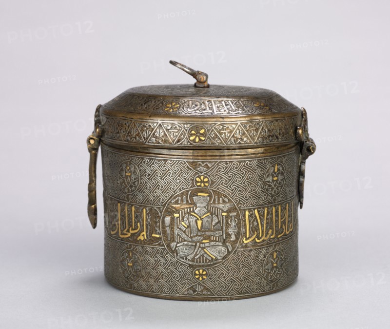 Luxury Inlaid Container, c. 1250-1350. Norther Iraq, Ayyubid period, 13th-14th century. Sheet brass, inlaid with silver and gold; diameter: 11.4 cm (4 1/2 in.); overall: 12 cm (4 3/4 in.); diameter of box: 10.1 cm (4 in.); box: 9.7 cm (3 13/16 in.).