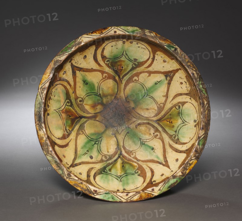 Bowl, 1100s-1200s. Northwest Iran, Aghkand (Azerbaijan area), 12th-13th century. Earthenware with underglaze slip-painted decoration; overall: 9.8 x 31 cm (3 7/8 x 12 3/16 in.).