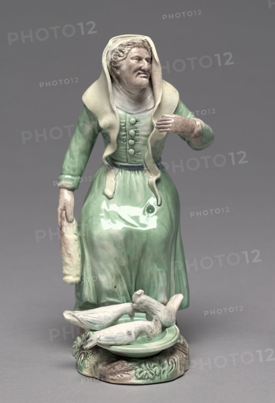 Old Woman Feeding Chickens, c. 1770. Staffordshire Factory (British). Earthenware; overall: 19.7 cm (7 3/4 in.).