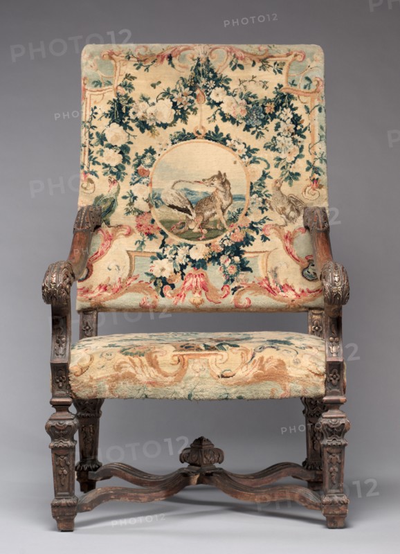 Chair, before 1717. Royal Savonnerie Manufactory, Chaillot Workshops (French, est. 1627). Carved wood, Savonnerie knotted-pile (symmertrical rug knot) upholstery; wool, hemp; overall: 121.9 x 70.5 x 55.3 cm (48 x 27 3/4 x 21 3/4 in.).