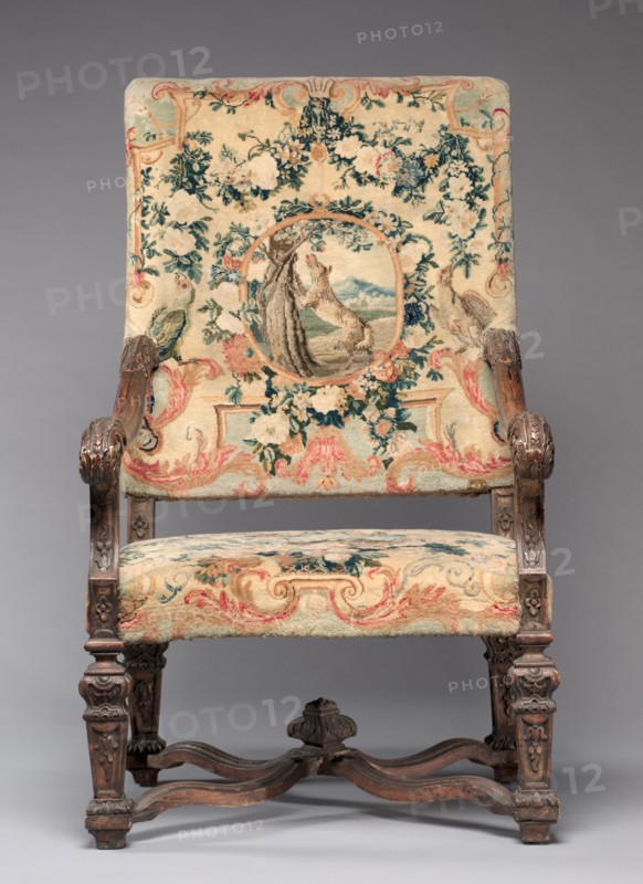 Chair, before 1717. Royal Savonnerie Manufactory, Chaillot Workshops (French, est. 1627). Carved wood, Savonnerie knotted-pile (symmertrical rug knot) upholstery; wool, hemp; overall: 121.9 x 70.5 x 55.3 cm (48 x 27 3/4 x 21 3/4 in.).