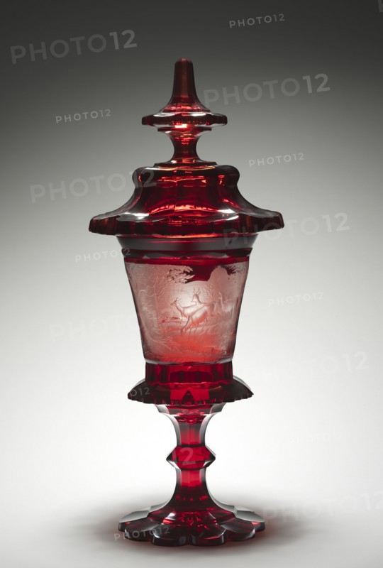 Covered Cup, mid-1800s. Bohemia, 19th century. Ruby glass with engraved decoration; diameter: 36.5 x 17.5 cm (14 3/8 x 6 7/8 in.); overall: 59 cm (23 1/4 in.).
