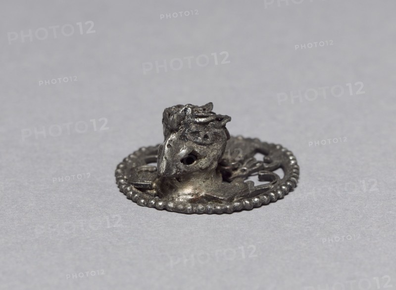 Eagle Ornament, c. 1200-1519. Mexican, Oaxaca, Mixtec style. Silver; diameter: 2.2 cm (7/8 in.); overall: 0.7 cm (1/4 in.).