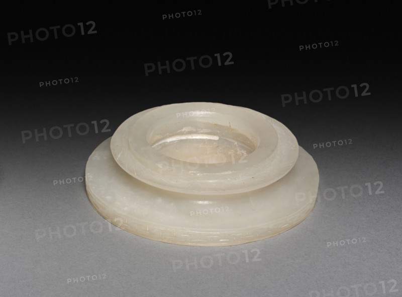 Three-Sectional Altar Group: Small Bowl with Carved Dragon (upper section of base), Qing Dynasty. China, Qing dynasty (1644-1911). Jade; overall: 7 x 6.7 cm (2 3/4 x 2 5/8 in.); with base: 10.8 cm (4 1/4 in.); upper base: 2.5 x 5.5 cm (1 x 2 3/16 in.); base assembled: 3.8 x 5.5 cm (1 1/2 x 2 3/16 in.).