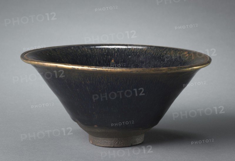 Tea Bowl, 1100s-1200s. China, Fujian province, Southern Song dynasty (1127-1279). Stoneware with black "hare’s fur" glaze and metal-bound rim, Jian ware; diameter: 17.8 cm (7 in.); overall: 8.7 cm (3 7/16 in.).