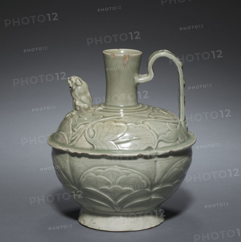 Ewer with a Lion-shaped Spout, 10th-11th century. China, Shaanxi province, Tongshuan, Huangbaozhen, Five Dynasties period (907-960) or Northern Song dynasty (960-1126). Green-glazed porcelaneous stoneware with modeled, carved and incised decoration, Yaozhou ware; overall: 18.3 cm (7 3/16 in.).