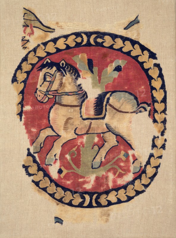 Curtain Fragment with Galloping Horse, 500s. Egypt, Antinoë, Byzantine period, 6th century. Plain weave (tabby) with inwoven slit-tapestry weave; wool ; overall: 41.9 x 30.5 cm (16 1/2 x 12 in.).