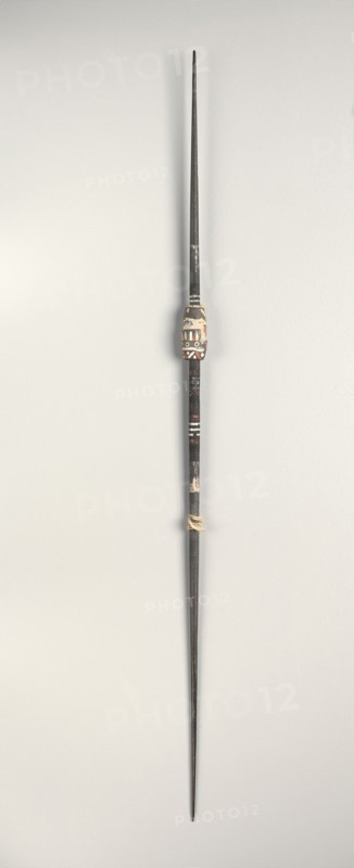 Spindle, c. 1st-3rd century. Peru, South Coast, Nasca style, early period. Wood with carved clay whorl; overall: 32 x 1.2 x 1.2 cm (12 5/8 x 1/2 x 1/2 in.).