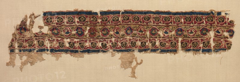 Fragment of a Tiraz-Style Textile, 1081 - 1101. Egypt, Fatimid period, Caliphate of al-Mustansir or al-Musta'li, c. AH 475-495 (A.D. 1081-1101). Tabby ground with inwoven tapestry ornament; linen and silk; overall: 9.3 x 29.9 cm (3 11/16 x 11 3/4 in.).