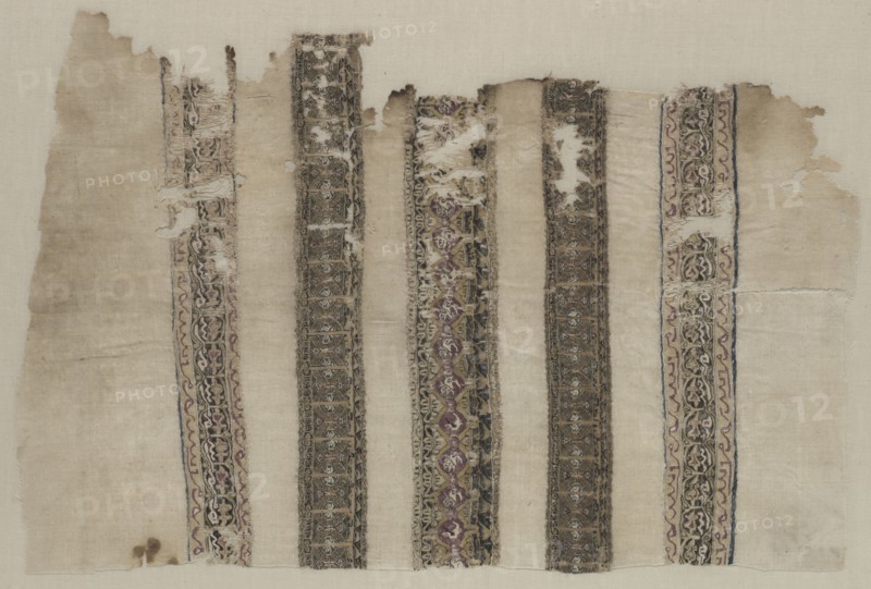 Fragment Composed of Parts of Three Tiraz-Style Textiles, 1094 - 1101. Egypt, Fatimid period, probably during Caliphate of al-Musta'li, AH 487-495 (A.D. 1094-1101). Tapestry (originally inwoven in a tabby ground); linen and silk; overall: 59.4 x 39.2 cm (23 3/8 x 15 7/16 in.).