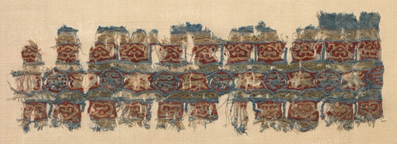 Fragment of a Tiraz-Style Textile, 1081 - 1101. Egypt, Fatimid period, Caliphate of al-Mustansir or al-Musta'li, c. AH 475-495 (1081-1101). Tabby ground with inwoven tapestry ornament; linen and silk; overall: 7 x 21.6 cm (2 3/4 x 8 1/2 in.)
