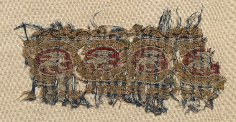 Fragment of a Tiraz-Style Textile, 1081 - 1101. Egypt, Fatimid period, latter part of Caliphate of al Mustansir or al-Musta'li, c. AH 475-495 (A.D. 1081-1101). Tapestry (originally inwoven in a tabby ground); linen and silk; overall: 6.4 x 10.5 cm (2 1/2 x 4 1/8 in.)