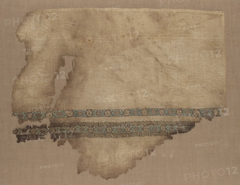 Fragment of a Tiraz, 1050 - 1058. Egypt, Fatimid period, Caliphate of al-Mustansir, c. AH 442-450 (A.D. 1050-1058). Tabby ground with inwoven tapestry ornament; linen and silk; overall: 22.3 x 27.3 cm (8 3/4 x 10 3/4 in.)