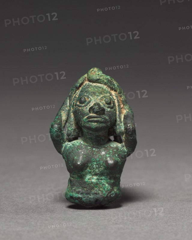 Woman with Water Jar, 400-1000. Peru, Mochica, 5th-10th Century. Bronze; overall: 4.2 x 3 x 3.6 cm (1 5/8 x 1 3/16 x 1 7/16 in.).