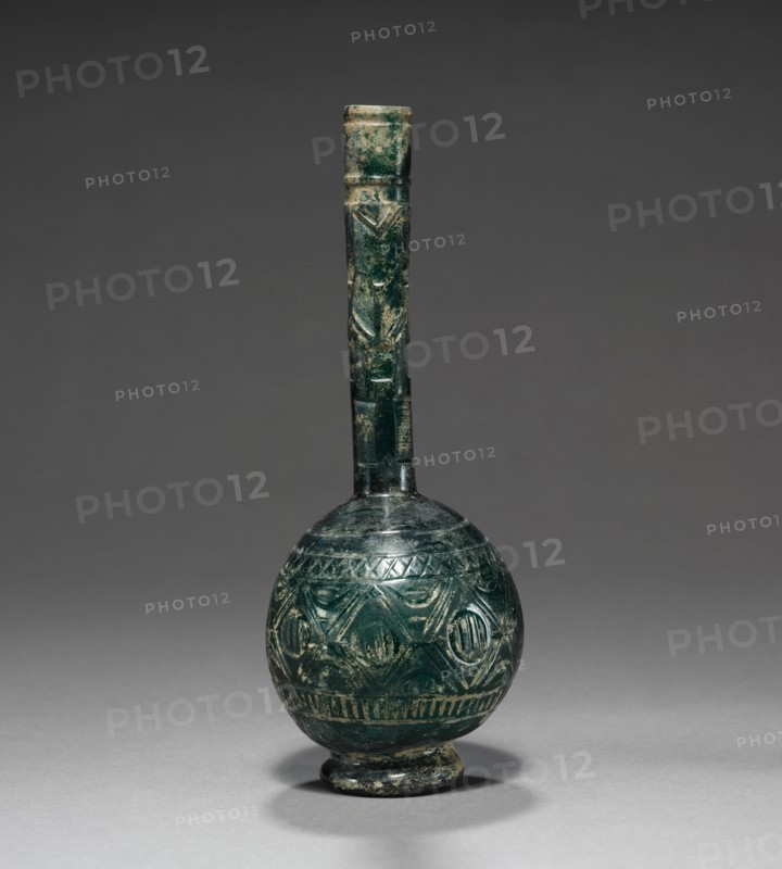 Bottle, 800s-900s. Iran, 9th-10th Century. Glass; overall: 21.6 cm (8 1/2 in.).