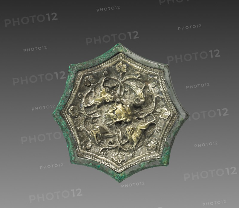Mirror with Animals and Birds, early 700s. China, Tang dynasty (618-907). Bronze inset with gilded-silver relief decoration; diameter: 5.1 cm (2 in.).