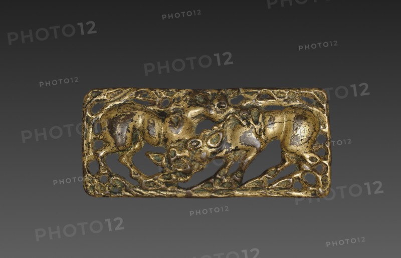 Belt Buckle with Animals, 202 BC- 9. China, Ordos region, Western Han dynasty (202 BC-AD 9). Gilt bronze; overall: 6.1 x 11.8 cm (2 3/8 x 4 5/8 in.).