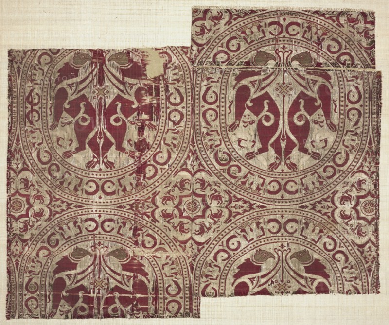 Lampas with griffins in roundels, from the Reliquary of Saint Librada in Siguenza Cathedral, 1100-1150. Spain, Almeria, Almoravid period. Lampas and plain-weave variant: silk and gold thread; overall: 37 x 40 cm (14 9/16 x 15 3/4 in.)