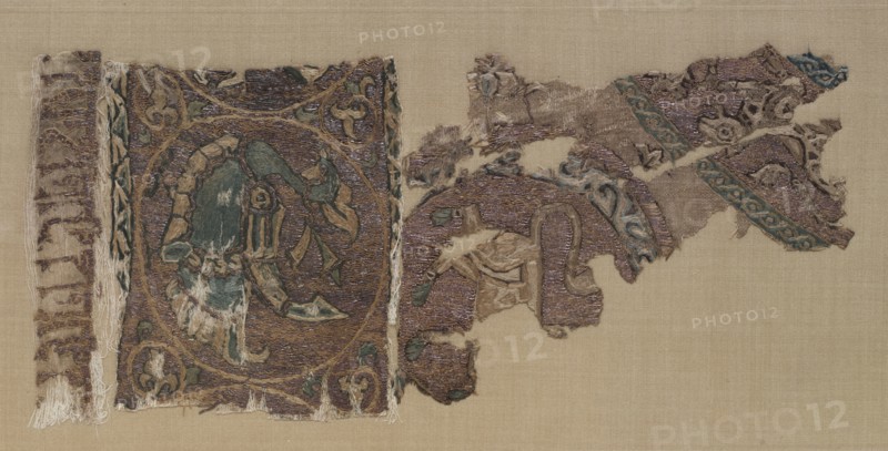 Embroidered border and field of animals in large roundels, 1000s-1100s. Iraq, probably Baghdad, Seljuk period. Plain weave: silk warp and cotton weft (mulham); embroidery, couched, split, running, and outline stitches: silk and gold thread; overall: 40 x 26 cm (15 3/4 x 10 1/4 in.)