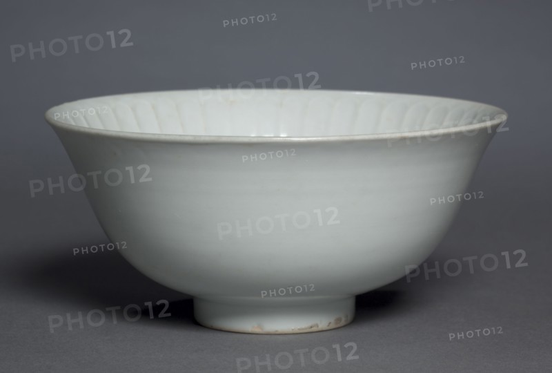 Bowl with Flower Petals, 1300s. China, Jiangxi province, Jingdezhen, Yuan dynasty (1271-1368). Glazed porcelain with molded decoration, Shufu ware; diameter: 17.2 cm (6 3/4 in.); overall: 7.9 cm (3 1/8 in.).