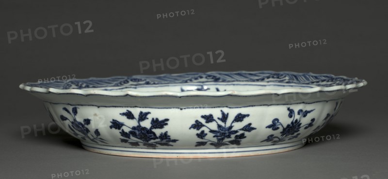 Plate with Grapes and Floral Sprays, 1426-35. China, Jiangxi province, Jingdezhen, Ming dynasty (1368-1644), Xuande reign (1426-35). Porcelain with underglaze blue decoration; diameter: 43.2 cm (17 in.); overall: 7.7 cm (3 1/16 in.).