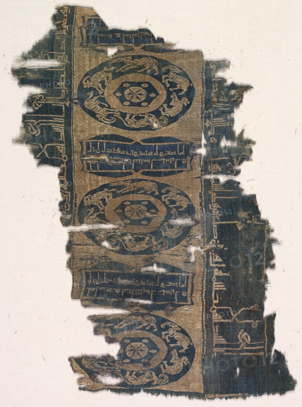 Brocaded silk fragment with running animal roundels and kufic inscriptions, 1530-1950. Iran. Lampas weave, brocaded; silk ; overall: 35.3 x 25 cm (13 7/8 x 9 13/16 in.).