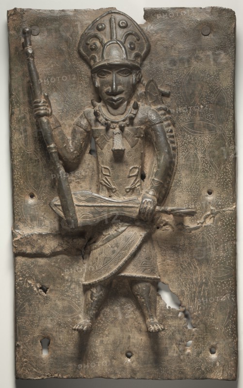 Plaque, possibly 1500s-1600s. Guinea Coast, Nigeria, Benin Kingdom, Edo, possibly 16th-17th century. Brass; overall: 49.4 x 30.6 cm (19 7/16 x 12 1/16 in.)