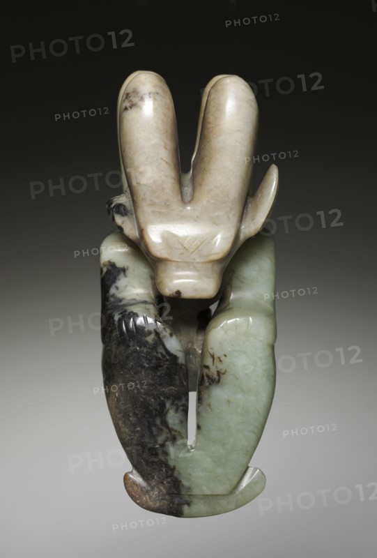 Amulet in the Form of a Seated Figure with Bovine Head, c. 4700-2920 BC. Northeast China, Neolithic period, probably Hongshan culture (4700-2920 BC). Jade (nephrite); overall: 13.2 cm (5 3/16 in.).